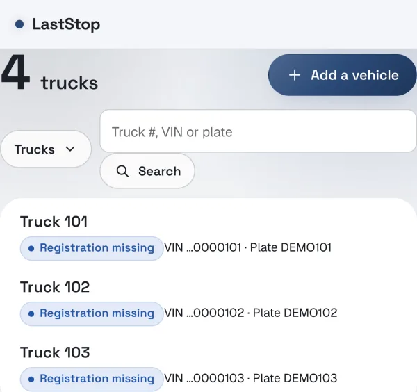 The Fleet page in LastStop for a demo company, listing trucks with their VIN and plate and a missing registration.